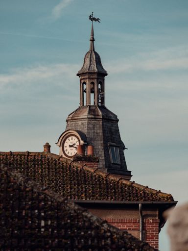 A vertical shot of the clocktower in Crecy La Chapelle, France