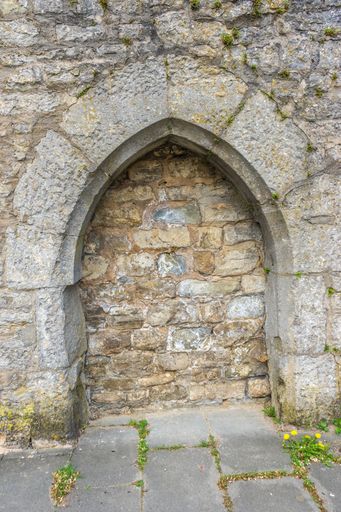 A vertical shot of an old stone arch in Rothenburg ob der Tauber, Germany