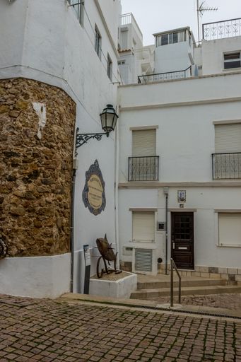 A vertical shot of an old building in the town of Portugal, Albufeira