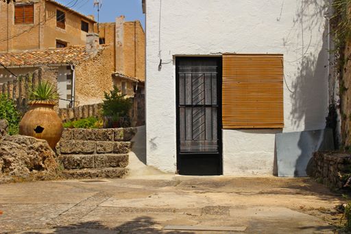 The external view of the typical village house on a sunny day in Spain