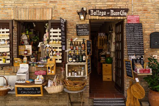 Gradara, Italy, Aug. 2021 - Typical souvenirs shops along a typical street of Gradara medieval town