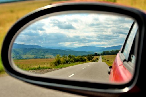 A beautiful landscape seen through the rearview mirror