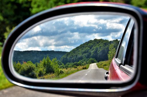 A beautiful landscape seen through the rearview mirror