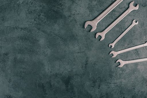 Wrenches tools on a dark textured background, copy space for text, repair and construction works, Labor Day