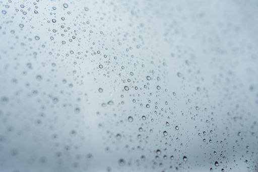 A view of Rain falls through the window. Crystal with drops in autumn