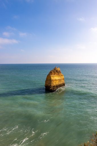 A natural view of the beautiful beaches near Benagil, Portugal in the summertime