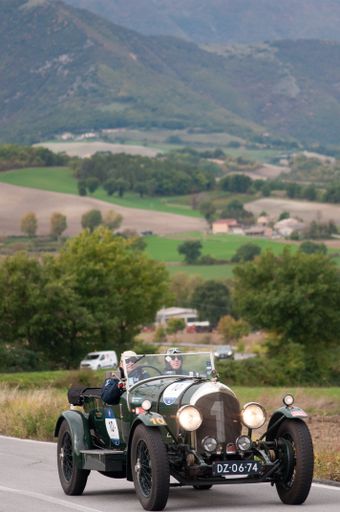 A vertical shot of an old racing car in Rally Mille Miglia in Cagli, Italy