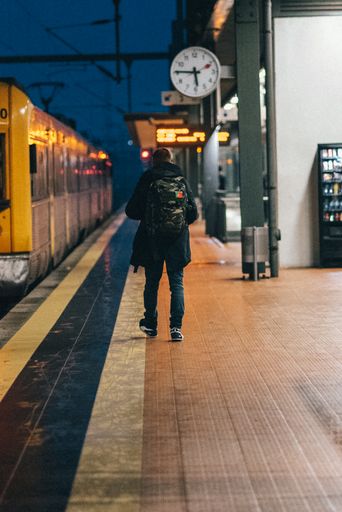 An urban scenery of a person at the underground metro at night