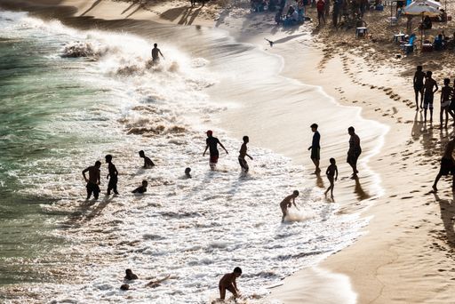 A closeup of a Large group of people on the beach