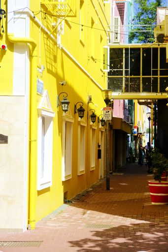 A vertical shot of yellow street alley in Curacao