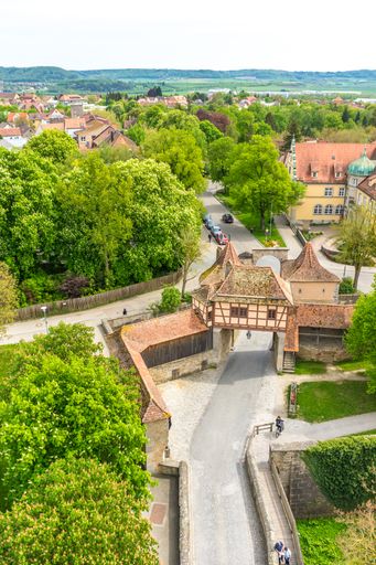 A vertical shot of the old buildings and green gardens in Rothenburg ob der Tauber, Germany