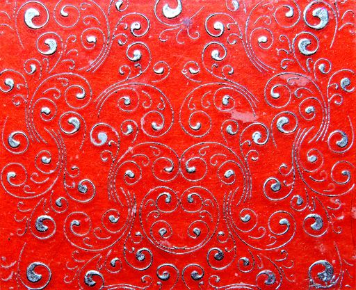 A closeup shot of white patterns on a red background