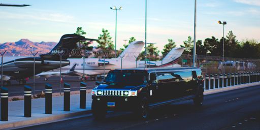 A beautiful shot of a black limo ride for the night