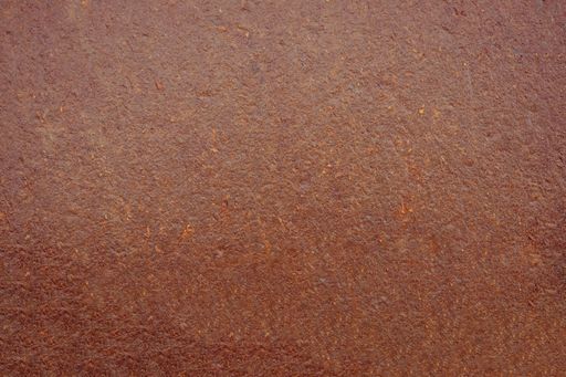 A closeup of a Brown metal plate surface texture background