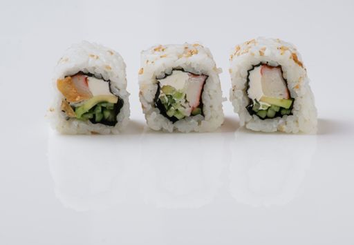 A closeup shot of sushi rolls isolated on white background.