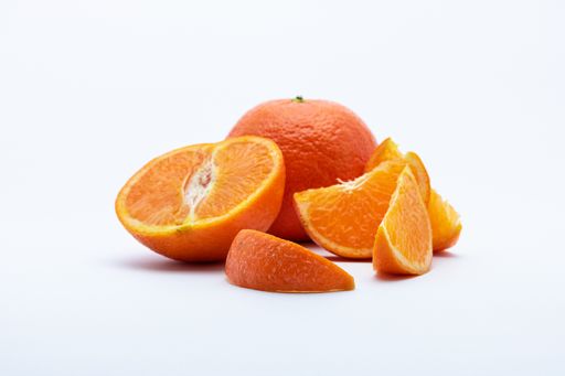 A photo of orange and orange slices isolated on a white background