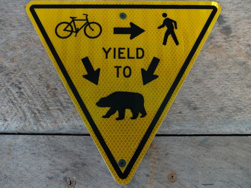 A closeup of a yellow warning sign
