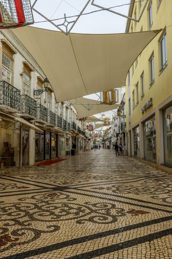 The old street with shops and buildings of Faro, Portugal