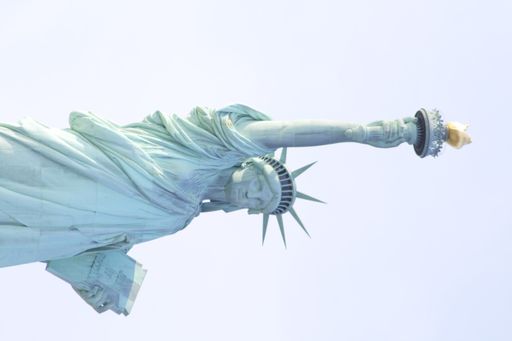 A vertical shot of the Statue of Liberty against the sky, Ney York City, USA