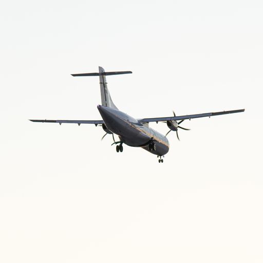 A closeup shot of an airplane on the white background