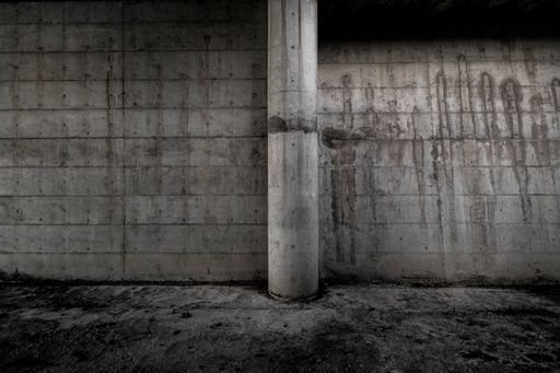 The concrete walls in an abandoned or unfinished architectural space