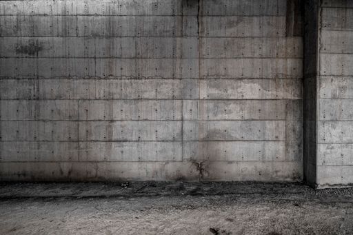 The concrete wall in an abandoned or unfinished architectural space