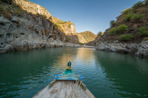 A beautiful view of a river and cliffs from a boat