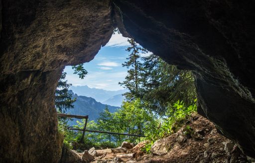 A beautiful view mountains and clouds from the rocky cave