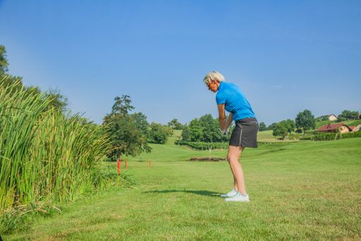 A female professional golfer playing at the golf course of Zlati Gric in Slovenia