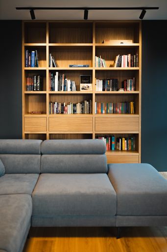 A beautiful and cozy living room with a bookcase
