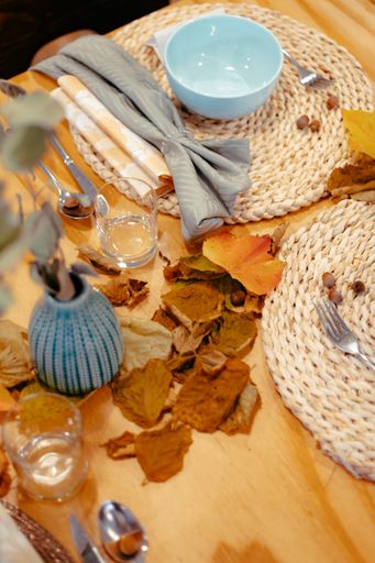 A beautiful closeup of autumn-themed table setting for a birthday celebration at a restaurant