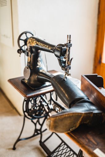 An old boot sewing machine inside a workshop