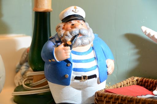 A closeup shot of the old captain figurine with a pipe
