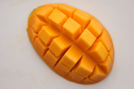 A top view of sliced mango isolated on white background