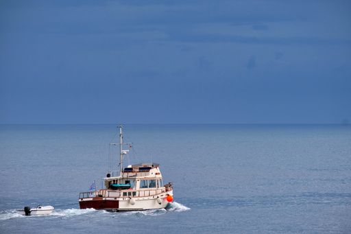 A beautiful shot of a yacht driving in the water.