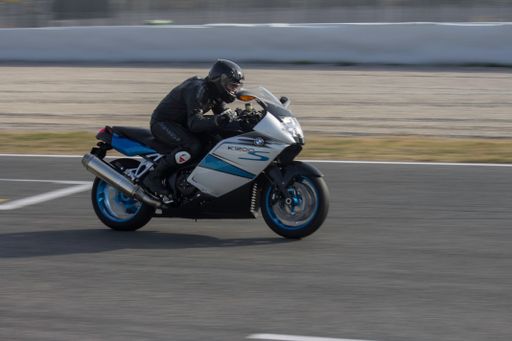 A driver on a Big sports bike model BMW k1200 on the circuit in Barcelona, Spain
