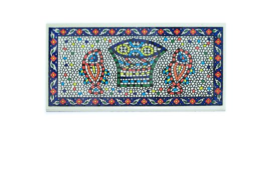 A closeup shot of a portuguese colorful ceramic mosaic tile isolated on white background