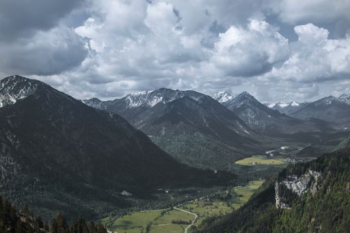 A beautiful shot of the Bavarian mountains and the green fields at dusk