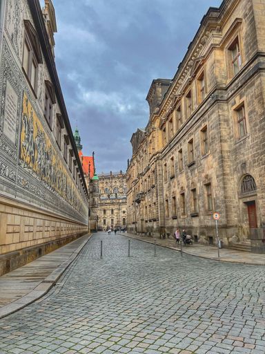 A vertical shot of a narrow street in Europe