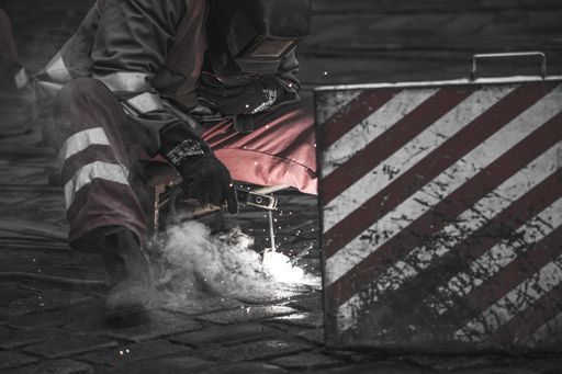 Works on the street, they are welding the tram tracks, the street is paved