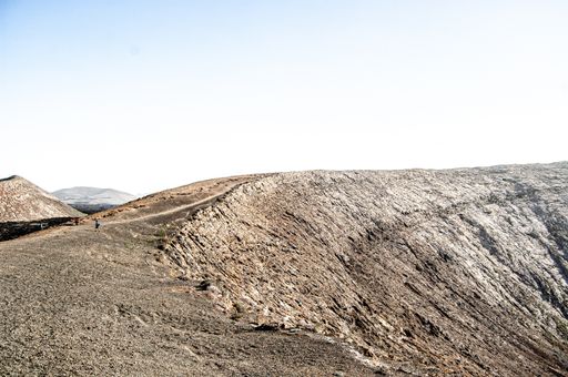 A beautiful shot of a landscape with people hiking in Lanzarote, Spain during daylight