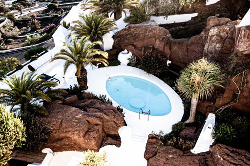 A high angle shot of a beautiful resort with an outdoor pool in Lanzarote, Spain