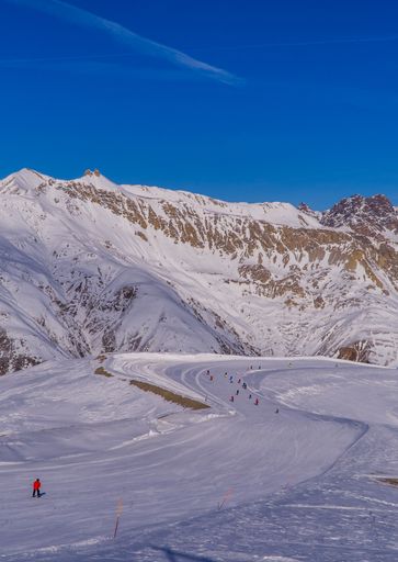 A vertical shot of Alps in Italy covered in snow.