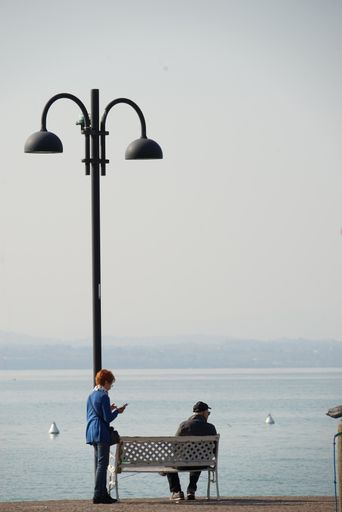 A senior couple enjoying a beautiful view of an ocean