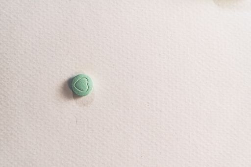 A high angle shot of a tablet on the table under the lights - medical concept