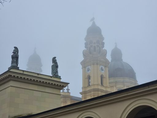 A closeup of the Munich Theatinerkirche at the Odeonsplatz during foggy day