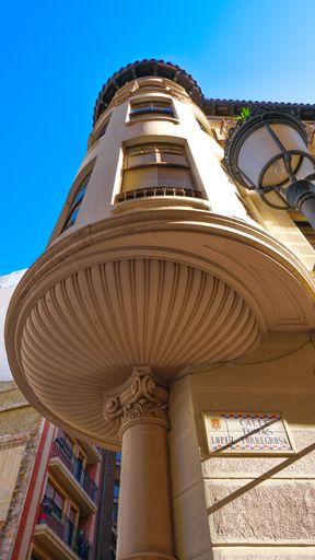 A vertical low angle shot of a building on a sunny day