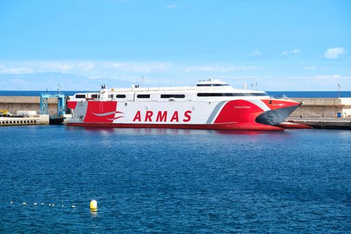 A car ferry parked at the dock of Puerto de la Estaca on El Hierro. Transportation and traveling on the Canary Islands.