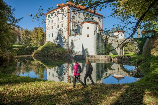 The tourists near the beautiful Sneznik castle in Sneznik, Slovenia