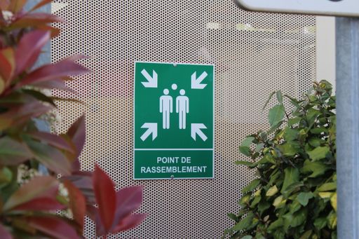 A closeup shot of the sign indicating an emergency assembly point